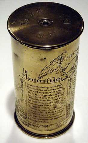 Shell IN FLANDERS' FIELDS engraved with John McCrae's poem on the left.