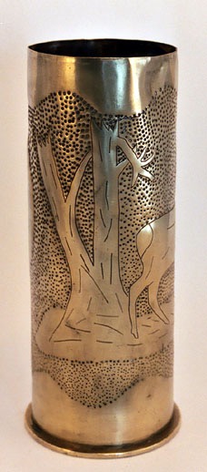 Shell with two deer emerging in open field&nbsp; from a devastated forest