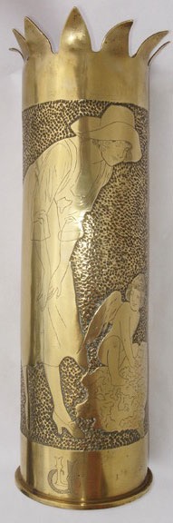 Shell with elegant lady looking over a cupid happily playing in the mud.