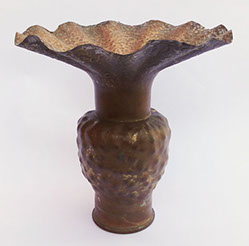 6 Pdr marked WNY [Washington Naval Yard] 1904 with a bulbous dappled body and a very flared top. Early Dirk Van Erp work.