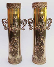 Pair of heavily ornated shells with intricate foliate pattern on upper and lower band. Large irises find their way up. Two handles