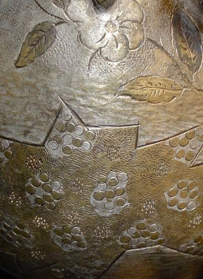 Metal basket up, helmet upside down. Detail of the outside&nbsp; with gold and silver flowers and&nbsp; groups of circles.