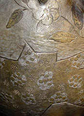 Metal basket up, helmet upside down. Detail of the outside&nbsp; with gold and silver flowers and&nbsp; groups of circles.