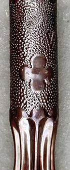 Shell with the 88th Division insignia, a sort of four-leaf clover, fluted and varnished 