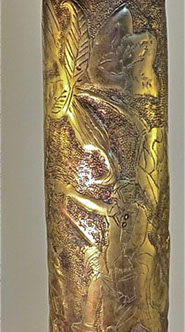 A jubilant Poilu is carried over a comrade's shoulder and pointing towards a Gallic Rooster perched on a 75 Field gun