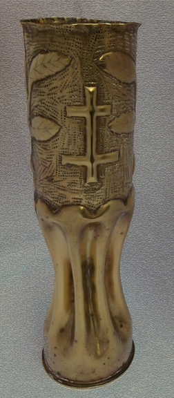 89thDivision shell with Cross of Lorraine on a background of small square punches