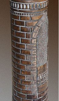 Shell Ypres Cloth Hall 1914 , center part of the building ina medallion&nbsp; with grooved stones and brickwork at the back.