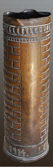 Shell Ypres Cloth Hall 1914. Top with decorative band, course of header bricks.