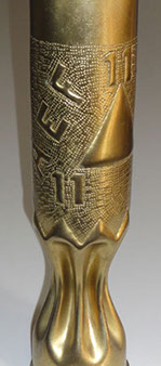 Shell 6th Division with letters AEF, a triangle&nbsp; with number eleven at each point.