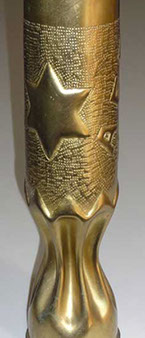 Six point star on an embossed background and a fluted body