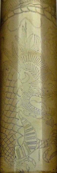 Shell with dragon engraved and coiled around the shell. Zig-Zag work post-WWI