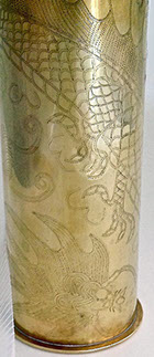 Shell engraved in zigzag work. Details of back legs claws and huge stylized beetle