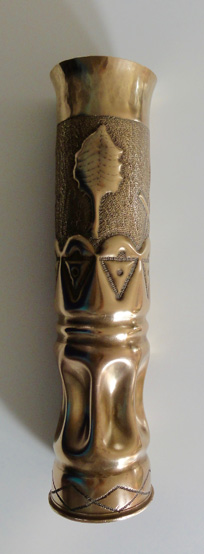 shell with Masonic symbols and a stylized leaf on an enbossed background