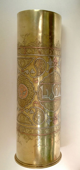 Shell decorated in DAMASCENE&nbsp; work of inlaid copper and silver and Arabian calligraphy in medallion.