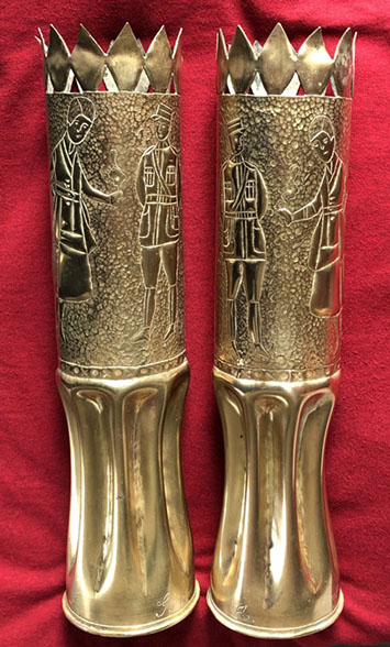 Pair of shells depicting a French officer looking at a woman in uniform smoking and harboring a bob haircut. Initials G. for him, A. for her.