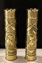 Pair of shells with scalloped tops, same design of garlands around medallions with Doughboy facing Poilu.