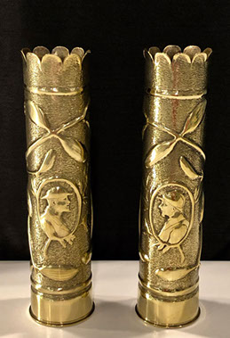 Pair of shells with scalloped tops, same design of garlands around medallions with Doughboy facing Poilu.