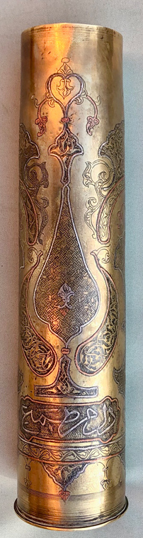 Shell with inlaid copper and silver decorative elements and eleborate segments featuring&nbsp; Islamic calligraphy. 