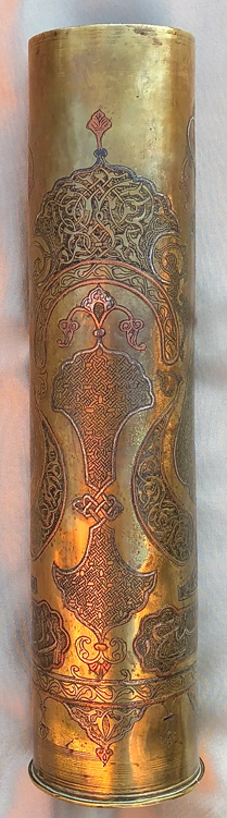 Shell with inlaid copper and silver decorative elements and eleborate segments featuring&nbsp; Islamic calligraphy. 