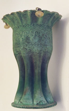 Fluted with Arabian etching decoration. Verdigris patina.