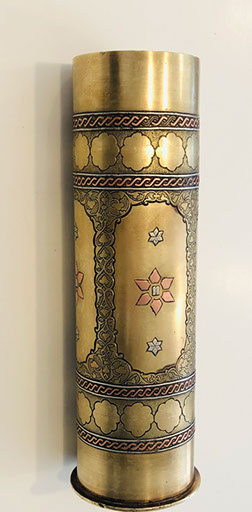 Shell decorated with copper band, embossed floral designs. Ten Commandments tablets in six-pointed star. Marked Bezalel in Hebreu.