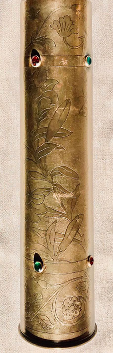 Top and bottom of engraved garlands of flowers. Long iris stem around body. Four sets of colored glass cabochons.