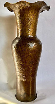 Tall shell marked Washington Naval Yard 1907, hammered into a vase by Arts & Crafts Movement artist near San Francisco.