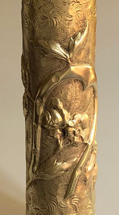 Shell embossed with a good luck horseshoe and roses on a background of Old Man's beard flowers. 