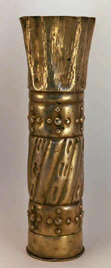 Shell with roundels and dimples, top flared