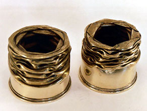 Shells annealed, fluted horizontally then flattened.