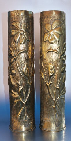 Pair of shells with mirrored image of anemones on a stippled background.