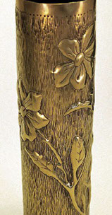 Shell with roses, prickly stems, leaves on a background with vertical indentations