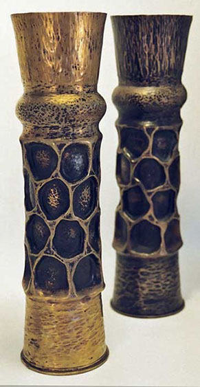 Pair of shells with honeycombed body, traces of dark paint, one with patina, the other polished.