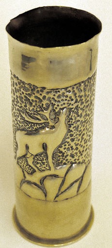 Shell with stag bellowing on top of mount