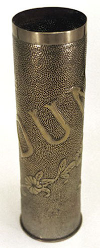 Shell VERDUN with a spiraling garland of flowers.