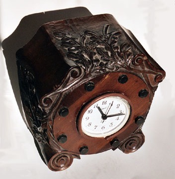Propeller Boss carved in a clock case in laminated mahogany with removable wood bolts. Set with a clock [not original].