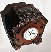 Propeller Boss carved in a clock case in laminated mahogany with removable wood bolts. Set with a clock [not original].