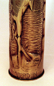 Shell with heron in a marshland, VERDUN engraved around the base. Details of toes...should be three upfront.