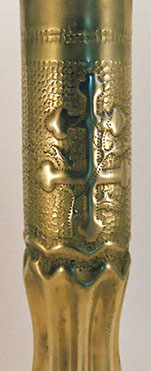 Shell Fleur-de-Lis and lobated Croix de Lorraine, with a climbing oak garland and a fluted body