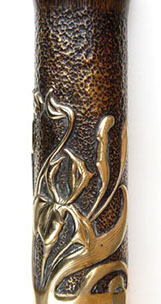 Shell with iris -art nouveau style-, on a darkened embossed background. Top flared.