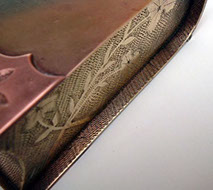 Jewel box in shape of a book with side-edges and fore-edge engraved with flowers. Zig-zag technique.
