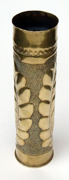 Shellwith Alsation girl standing and framed by a huge garland of laurels. Top has two rows of circles.