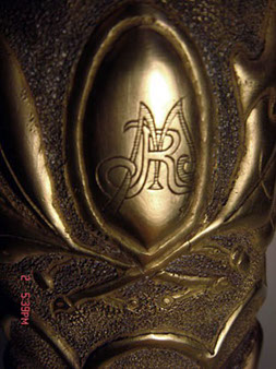 Shell with an oak and palm garland and a center medallion with initials M and R.